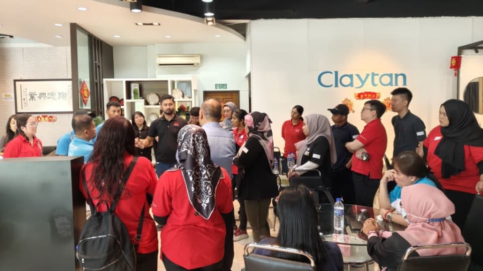 Jubin BMS staff listening to Clayton factory representative briefing